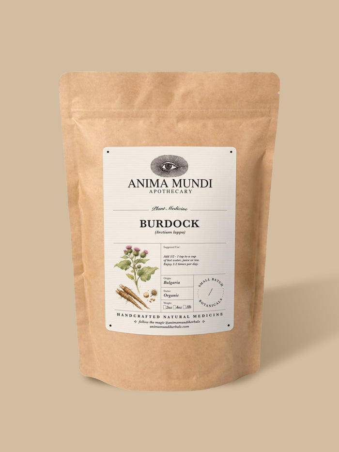 A kraft paper stand-up pouch of Anima Mundi Apothecary Ashwagandha herbal supplement, shown on a solid beige background.