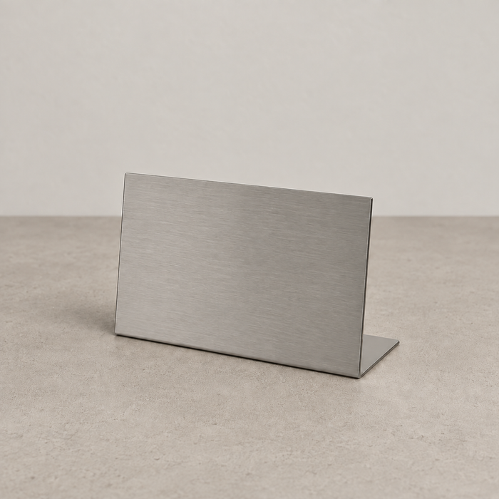 Landscape brushed stainless steel tabletop stand with a bent base.