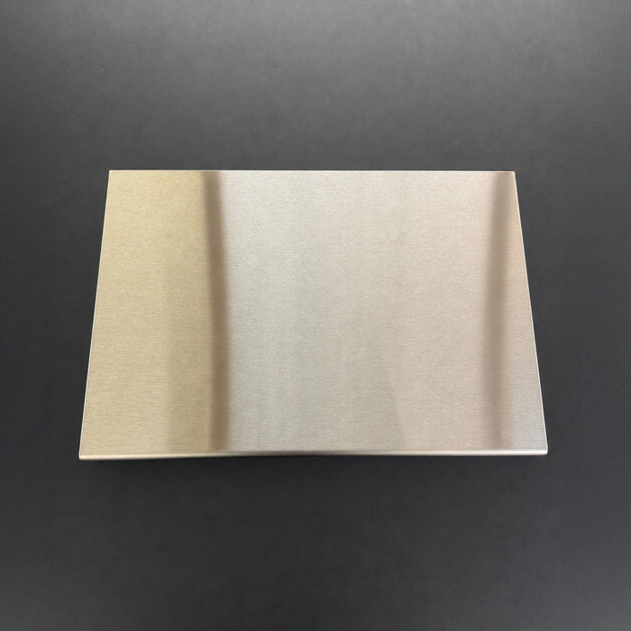 Blank low-profile stainless steel menu holder viewed from above.