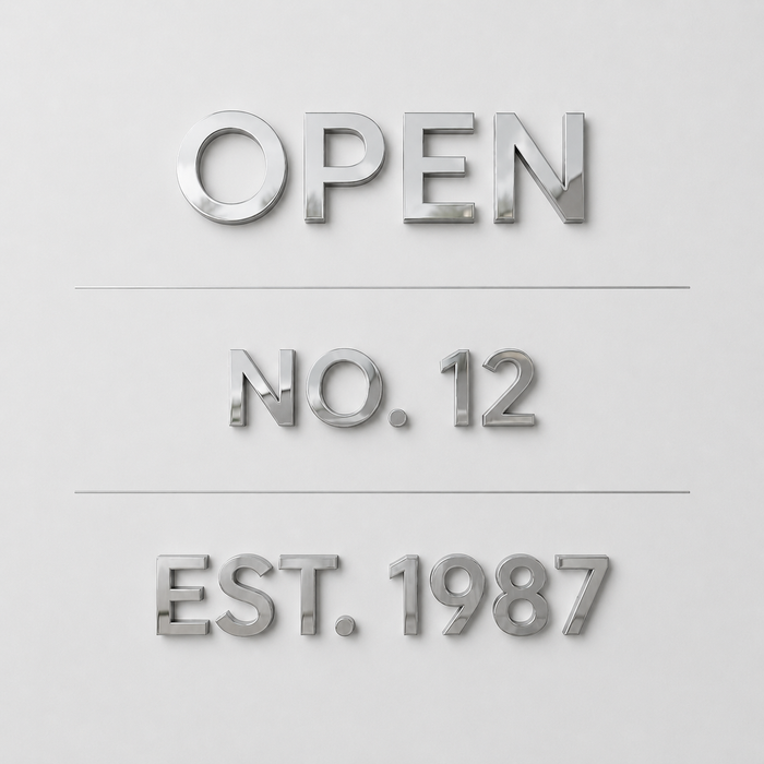 Mirrored stainless steel lettering samples reading Open, No. 12, and Est. 1987.