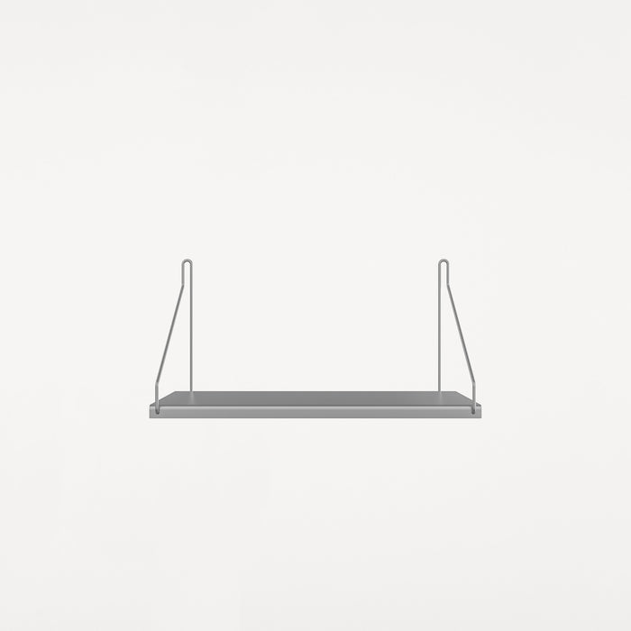 Single stainless steel shelf with two triangular wire mounting brackets.