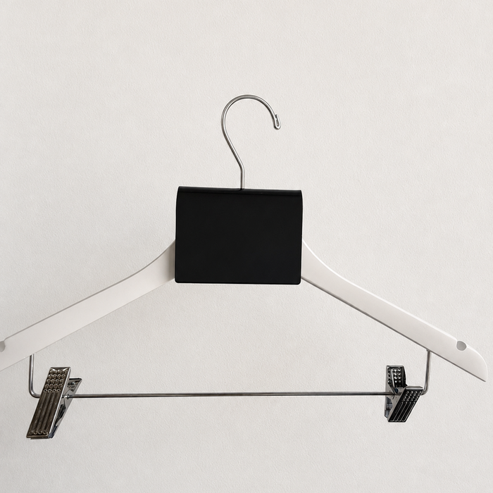Blank black acrylic sign clip on a white trouser hanger.