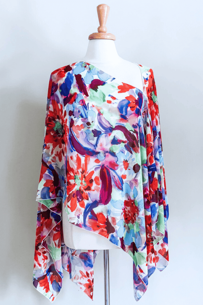 Premium fabric Butterfly Wrap featuring a colorful Jardin floral print with elegant draped styling.