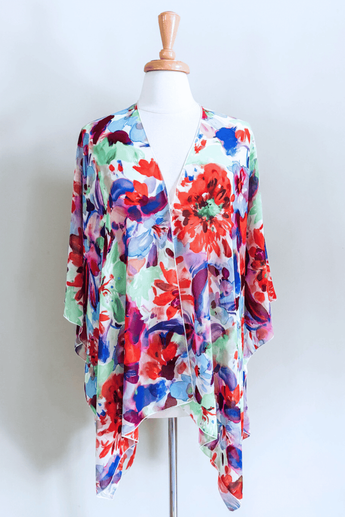 Premium fabric Butterfly Wrap featuring a colorful Jardin floral print with elegant draped styling.