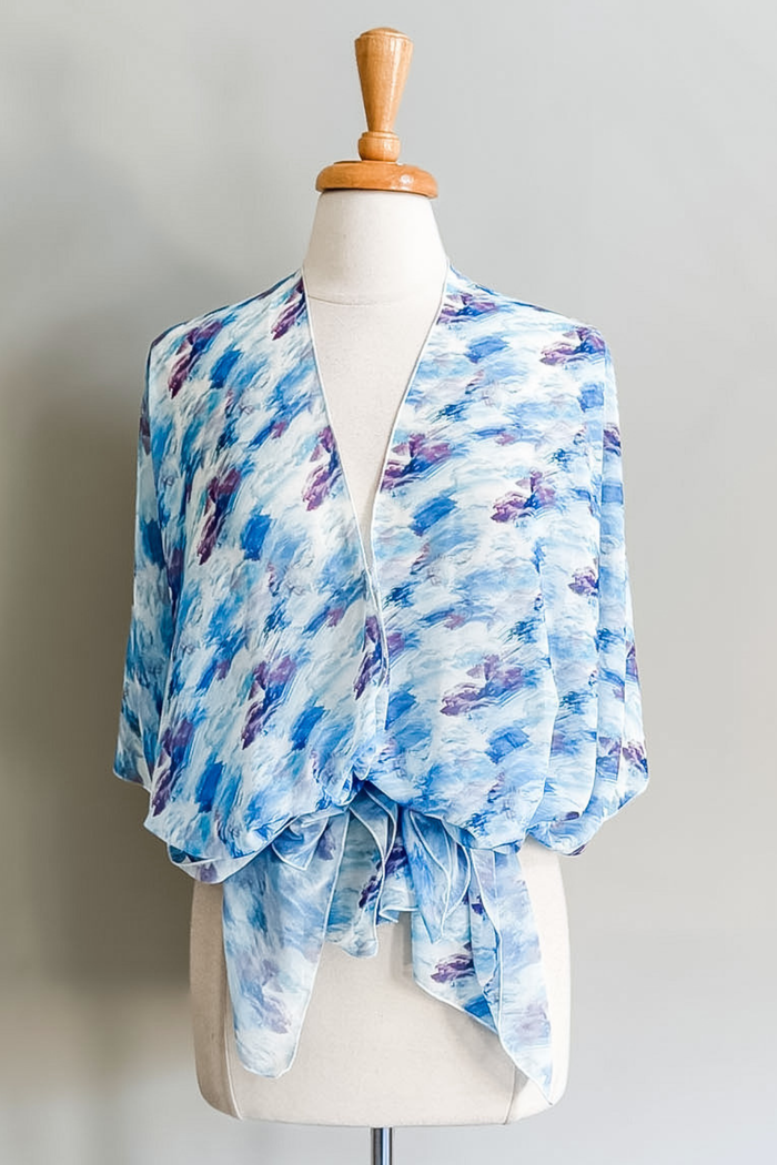 Diane Kroe Butterfly Wrap in Watercolor Wave print styled as a versatile wrap top for travel and resort wear