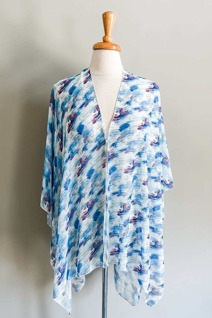 Diane Kroe Butterfly Wrap in Watercolor Wave print styled as a versatile wrap top for travel and resort wear