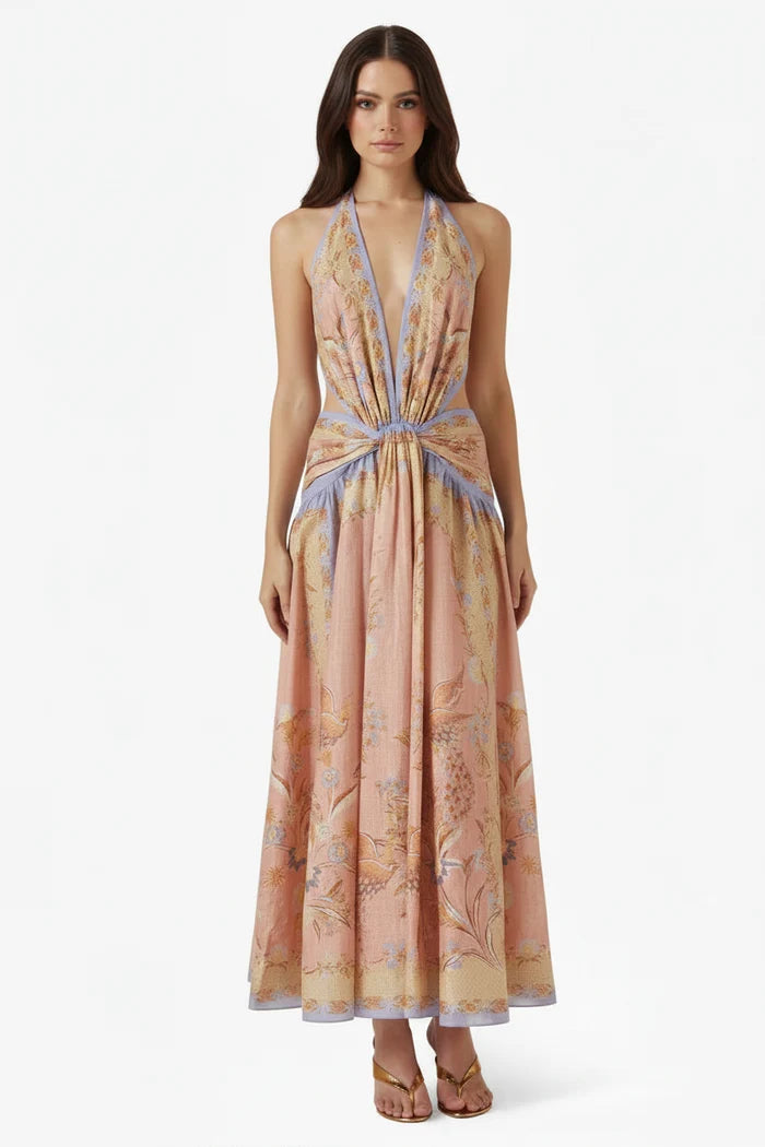 Woman wearing a floral patterned dress on a white background