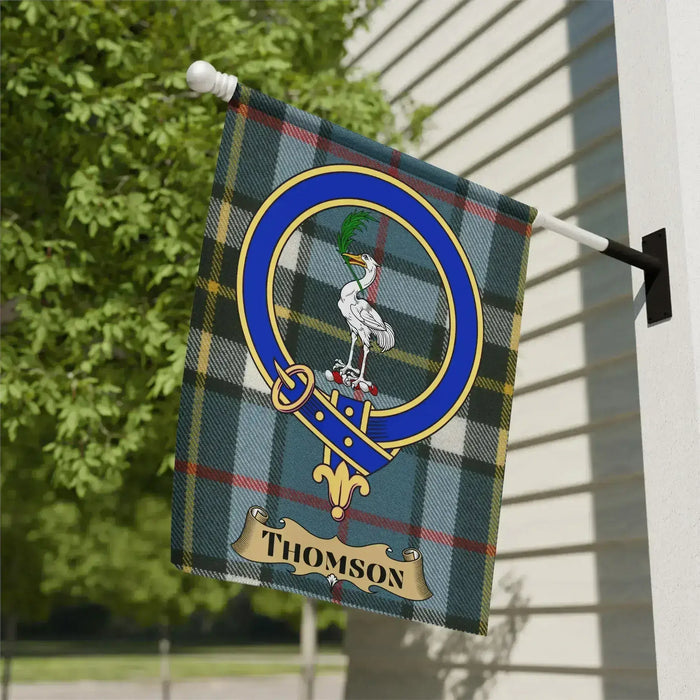 Thomson crest garden flag hanging outdoors