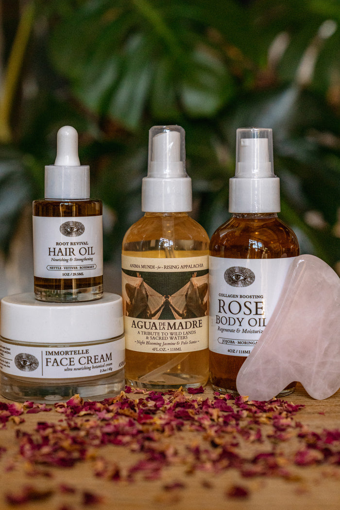 Collection of skincare and hair care products with natural elements on a wooden surface.