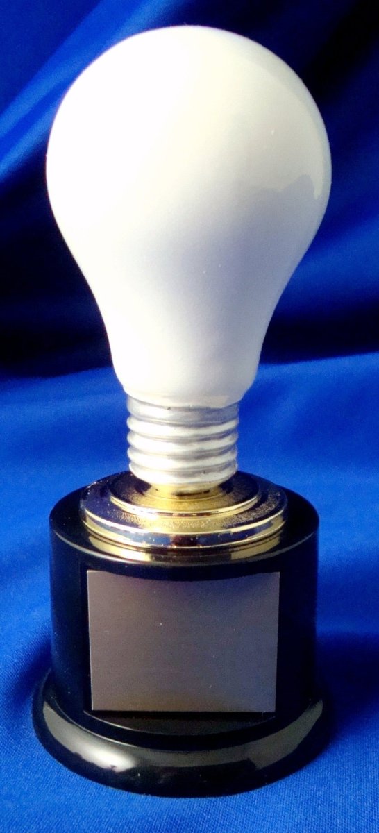 A white light bulb on a black round base with engraved text on the base, presented against a blue background.