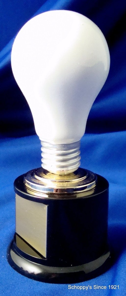 A white light bulb on a black round base with engraved text on the base, presented against a blue background.