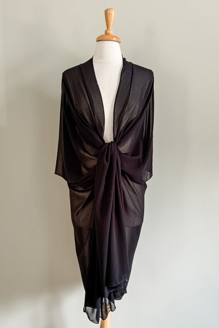 Diane Kroe Black Mariposa Kaftan styled as an elegant dress cover-up for beach or resort wear