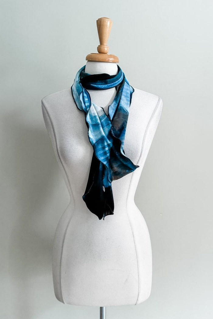 Sea Oasis print Sash worn as a scarf on a plain background