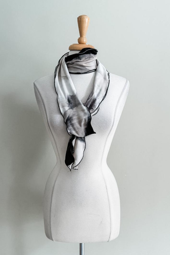 Oasis Sand print Sash worn as a scarf on a plain background