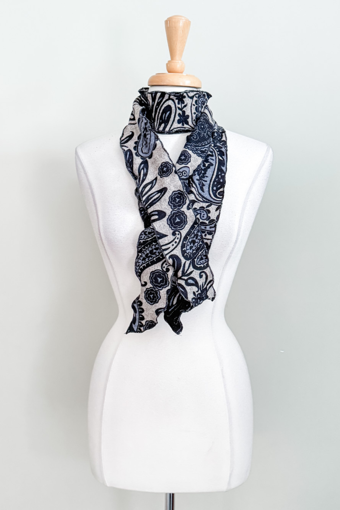 Matching sash in blue Spain print worn as a scarf