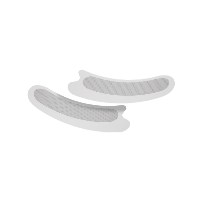 Two white silicone mats on a white background