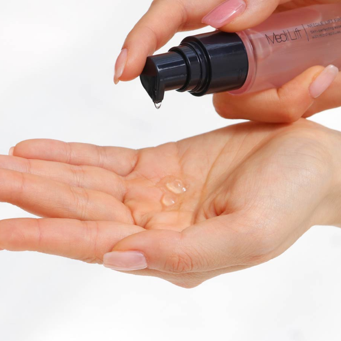 Hand holding a bottle of MedLift product over an open palm with a clear gel-like substance.