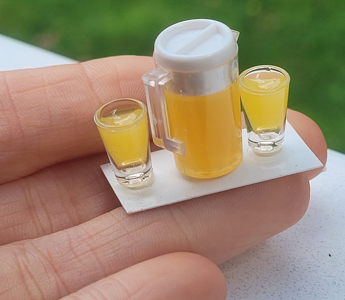 Orange Juice in Pitcher with 2 Glasses