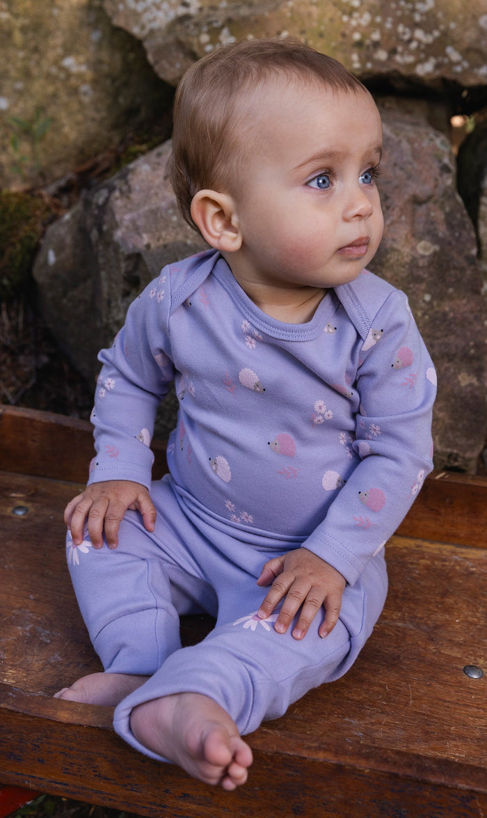 Deux par Deux baby girls evolutive pants in violet with flower details, lifestyle view