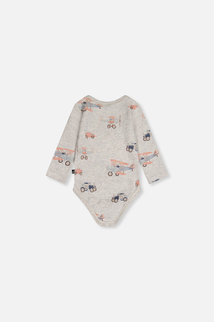 Close-up detail of the Deux par Deux organic cotton onesie with beige vintage airplane print, view 4