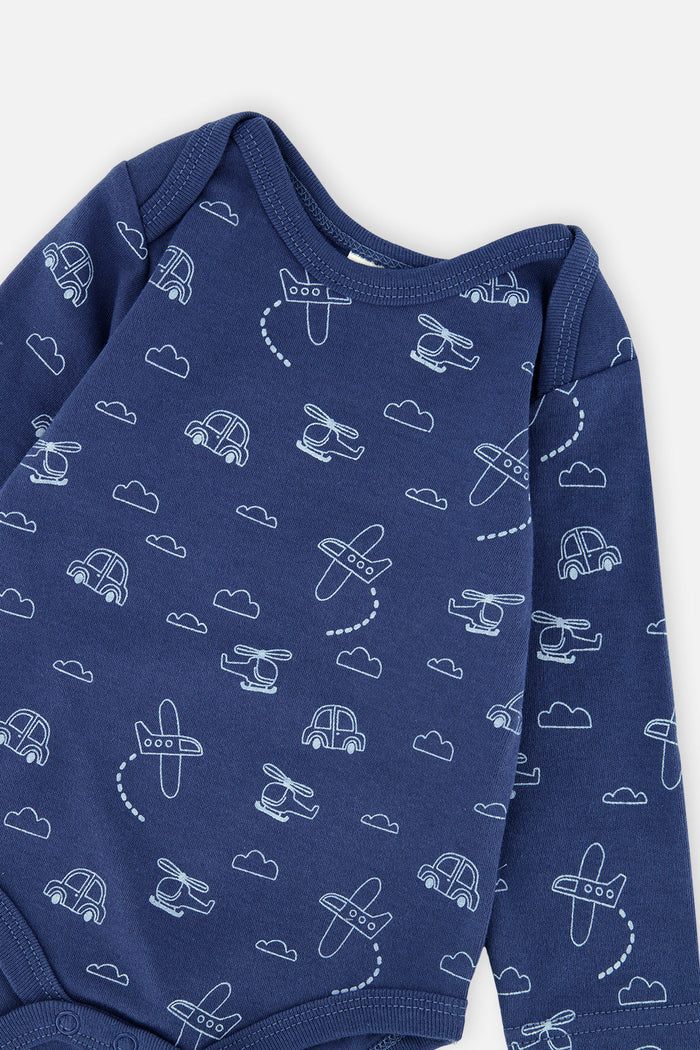 Close-up detail of the Deux par Deux organic cotton set with blue transportation-print onesie and striped overalls, view 4