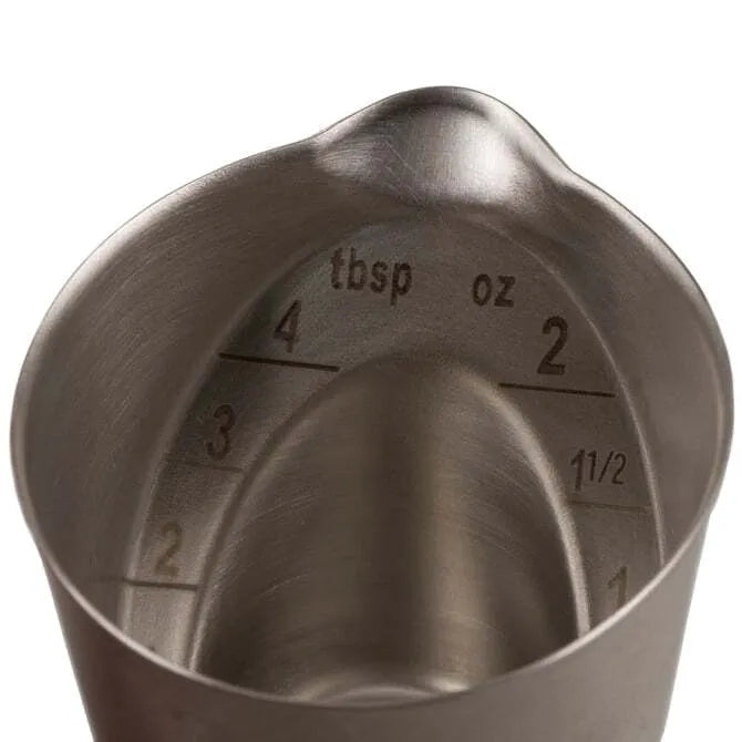 Stainless Steel Oxo Angled Measuring Cup - 2 oz showing lip on white background.