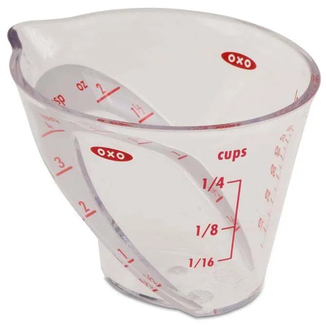OXO Angled Measuring Cup 2oz Capacity on white background.