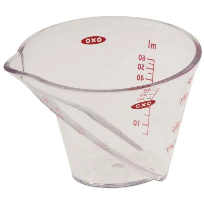 OXO Angled Measuring Cup 2oz Capacity side view on white background.