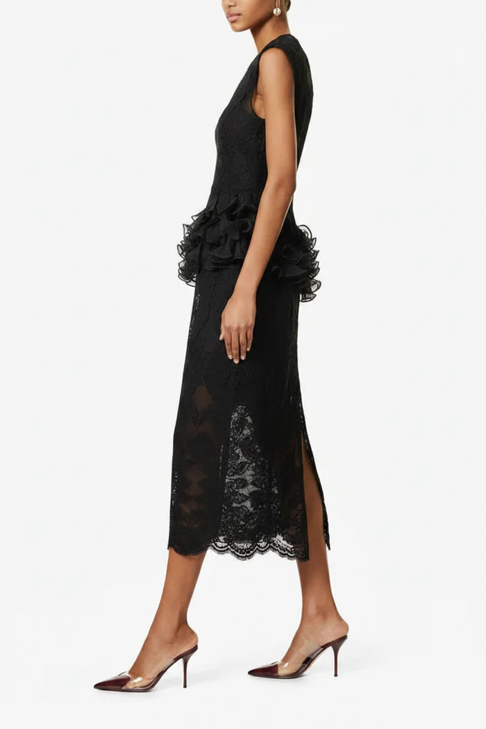 Black lace dress with ruffled details on a white background
