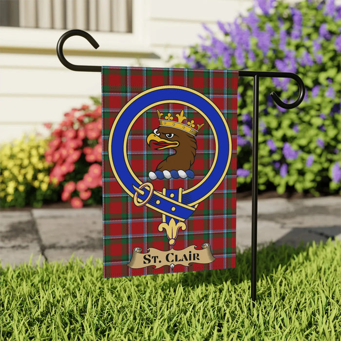 St. Clair Family Crest flag displayed in a garden